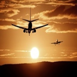 A photography of a jet air plane in sunset sky